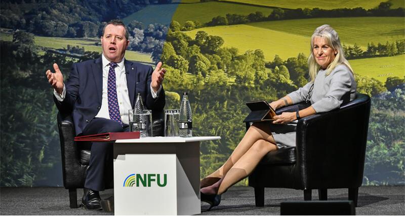 An image of Farming Minister Mark Spencer with NFU President Minette Batters on stage at NFU Conference 2023