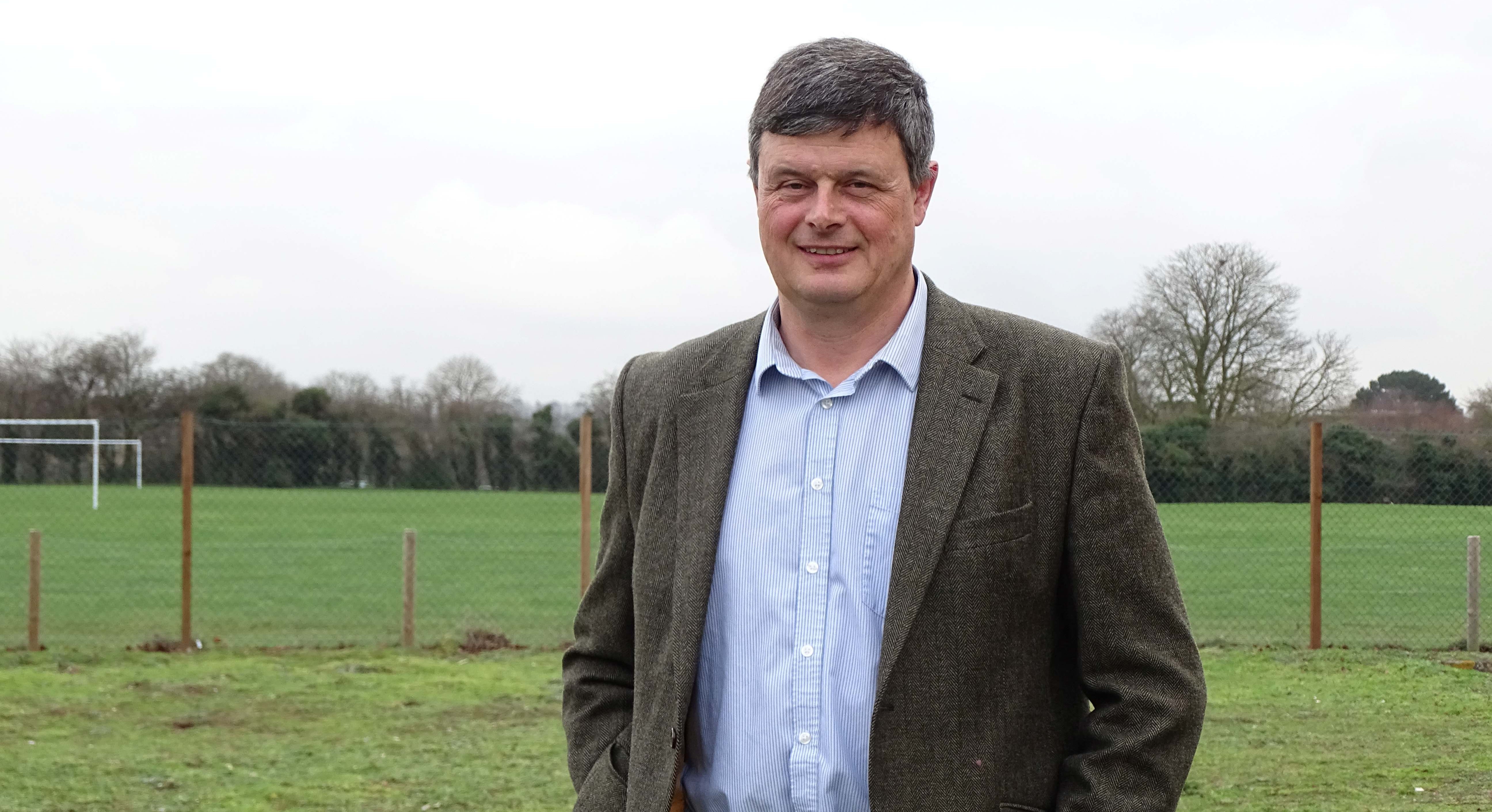 Farmer Nigel Barnes standing in a field