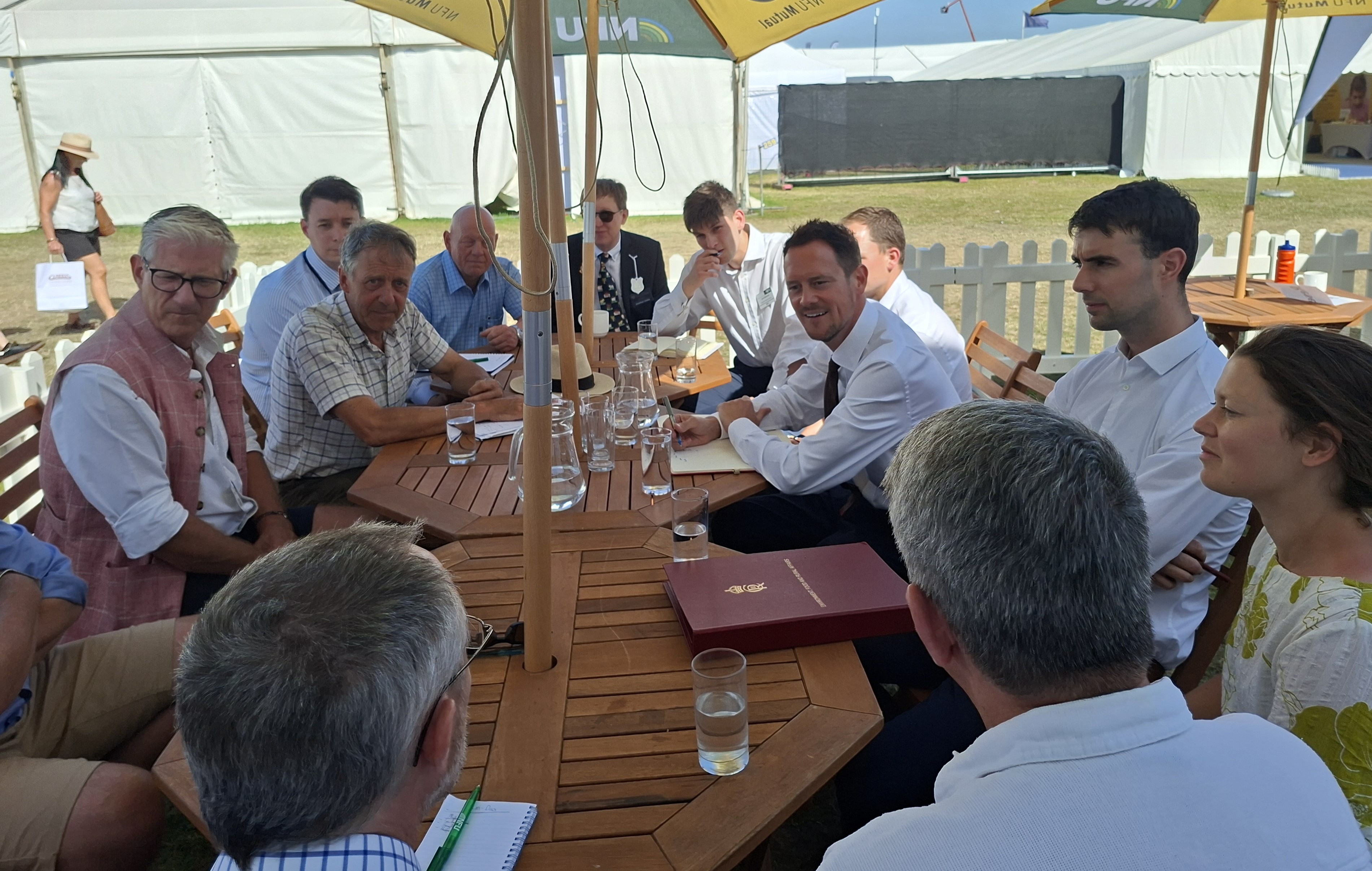 Meeting farming minister Stephen Morgan around a table outside at the Norfolk Show
