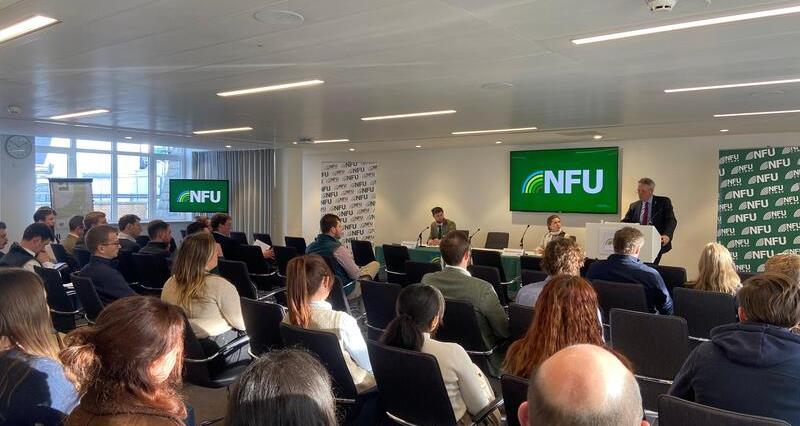 NFU Deputy President David Exwood talking to seated delegates from a lectern in a conference room