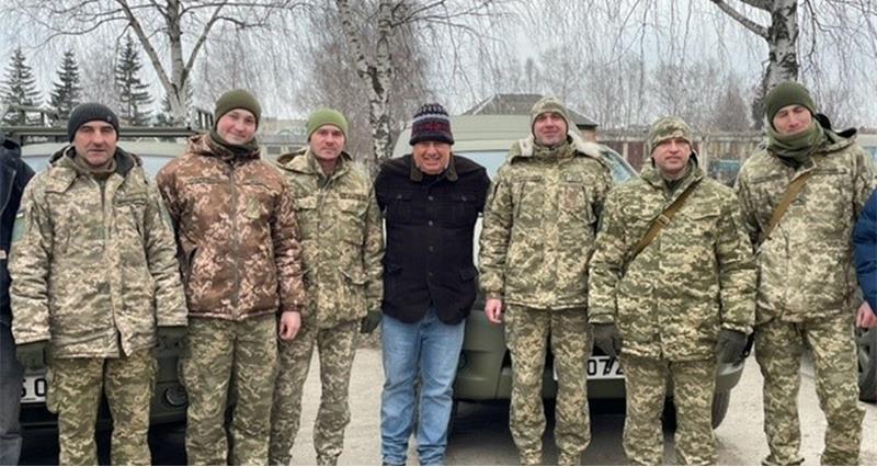 A farmer with soldiers in Ukraine
