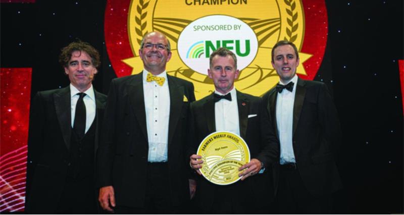 Nigel Owens standing at awards with Tom Bradshaw, Stephen Mangan and Andrew Meredeith
