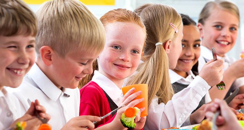 Children eating school dinner