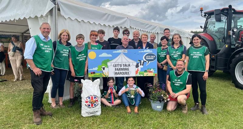 The Let's Talk Farming marquee team celebrating winning best stand