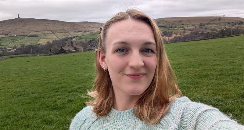 New NFU North Environment and Land Use Adviser Hannah Sutcliffe in a field with hills in the background