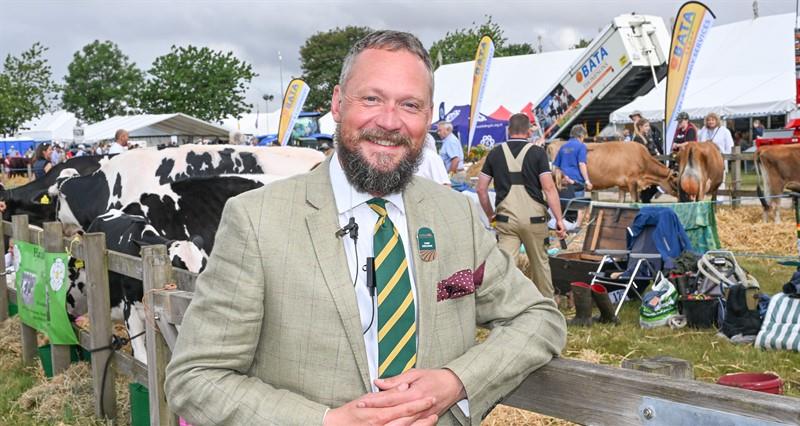 A photo of Driffield Agricultural Society Chief Executive Tom Woodall stood in front of displays and livestock at Driffield Show 2025