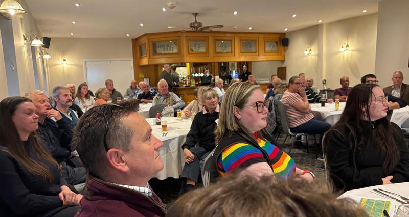 A photo of attendees of the Halifax Supper Club listening to a speaker 