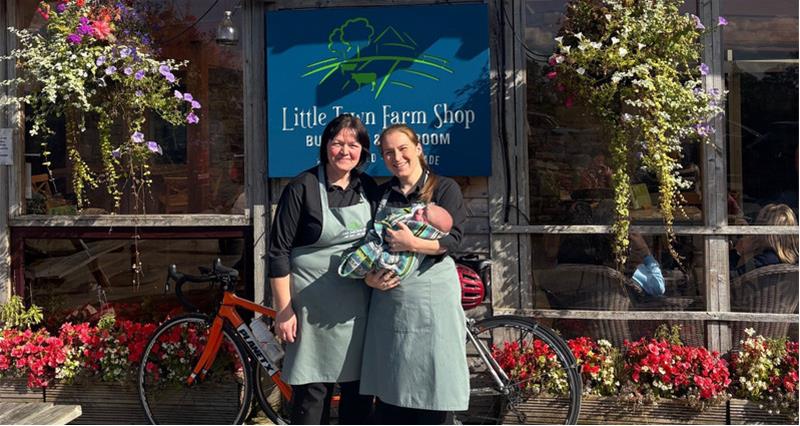 Little Farm Dairy's Julie and her daughter Nicola stood outside the business with a Little Town Farm Shop sign in the background