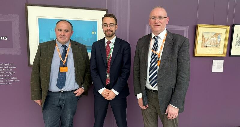 A photo of York East Chair Andrew Sewell with Luke Charters MP and member David Horsley at Portcullis House