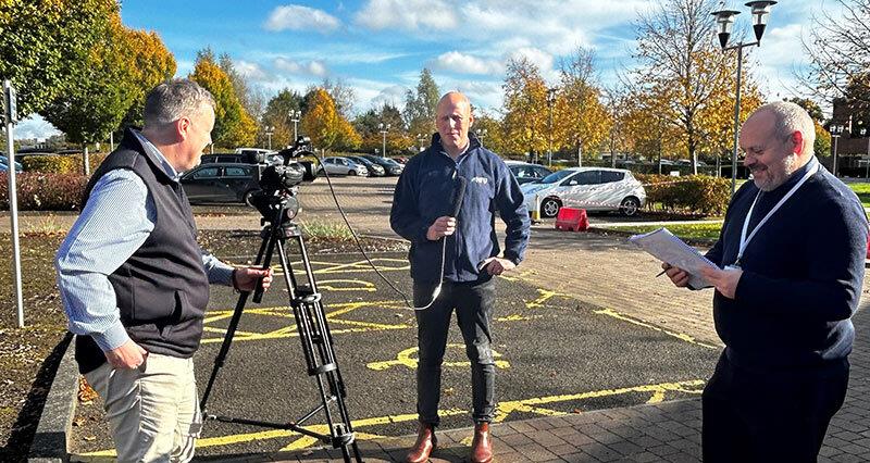 PIP 2024/25 participant George Cowper stands in front of a camera during media training