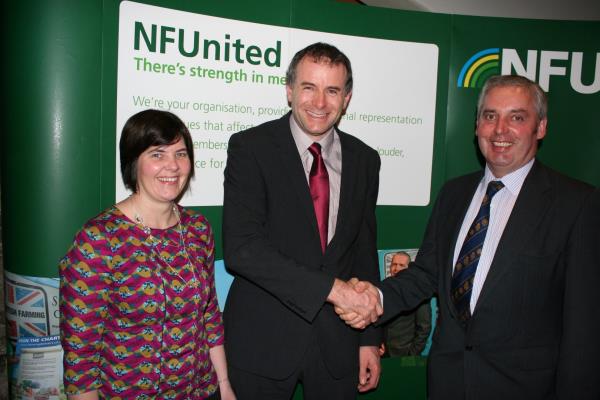Outgoing NFU Cumbria County Chairman Richard Geldard (centre) with wife Helen and incoming chairman David Raine_32420