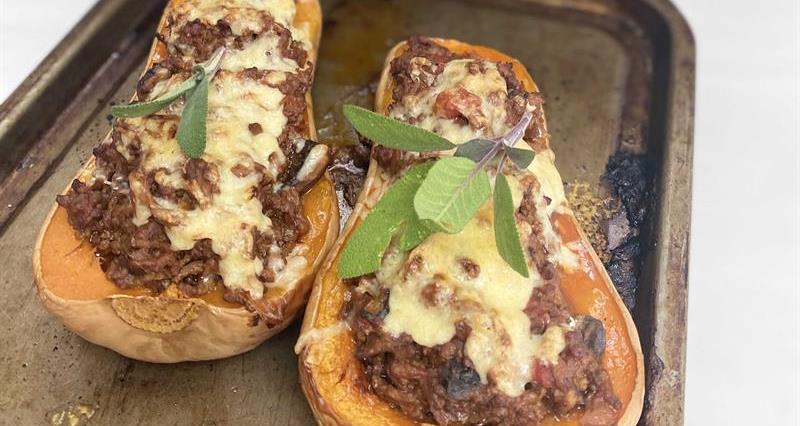 Baked butternut squash stuffed with beef and cheese