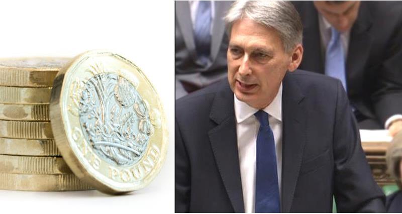 chancellor philip hammond and new pound coin - spring statement_52631