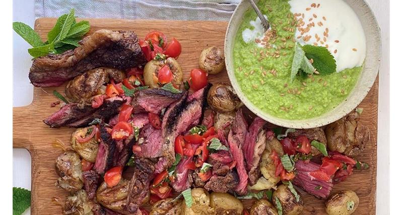 Barbecued steak with smashed rosemary potatoes and pea guacamole